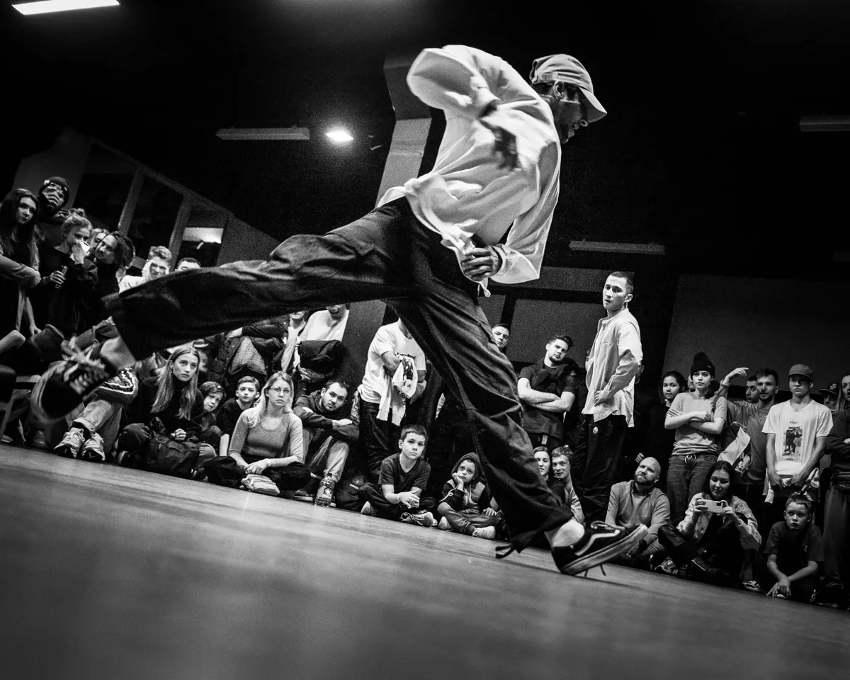 Dancer in a battle circle surrounded by the crowd