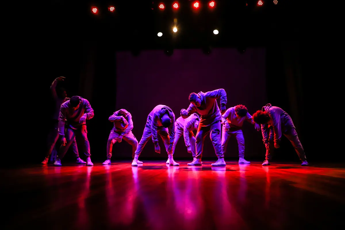 Crew on a red lit stage